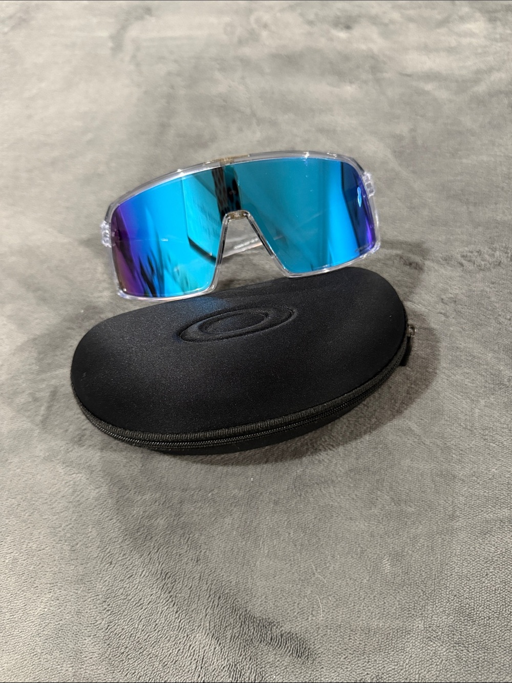 Oakley Clear Frame Sunglasses with Blue Mirrored Lenses
